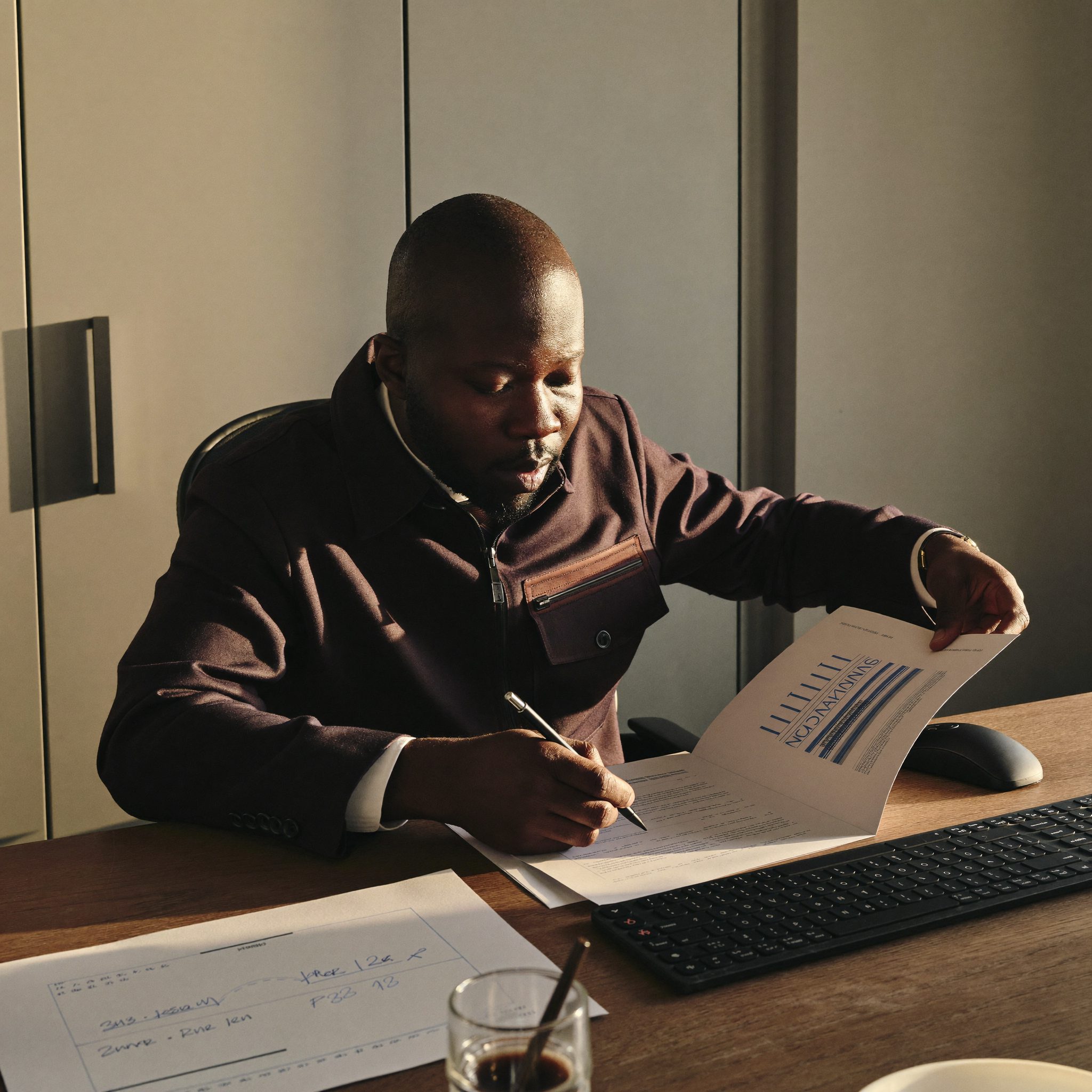 Financial advisor reviewing documents at a Cadelis Rivergate working session